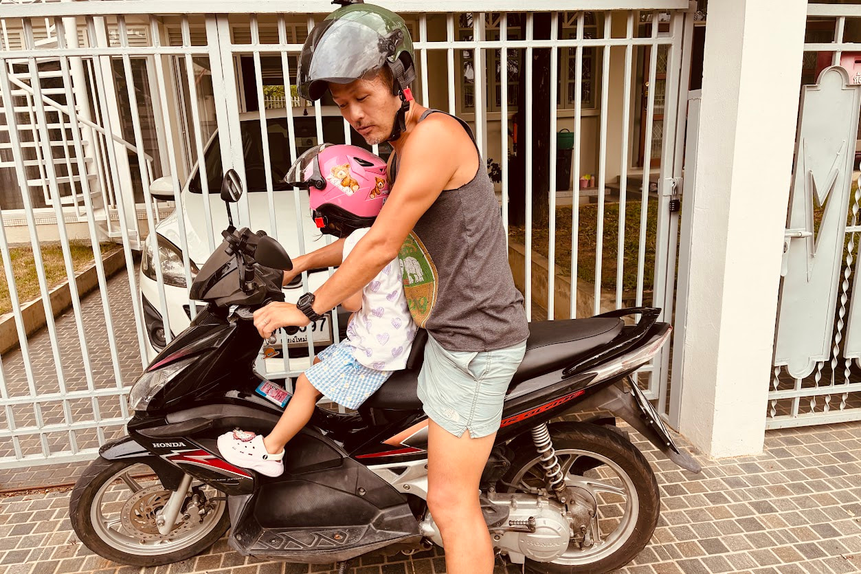 Riding a motorbike in Chiang Mai with my daughter