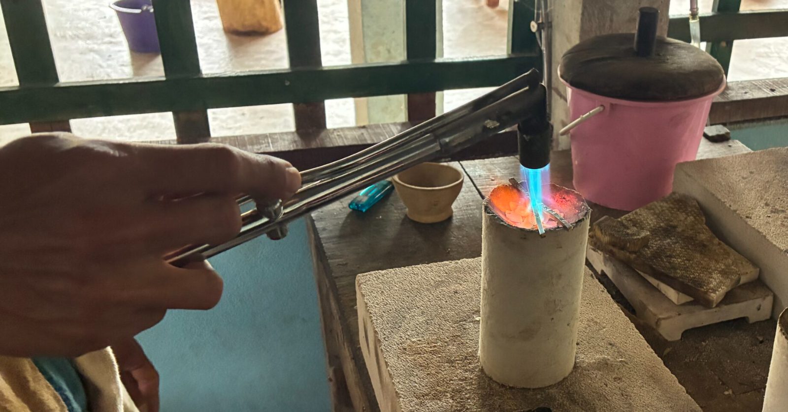 Melting granulated silver in a crucible at a Karen workshop in Lamphun, northern Thailand